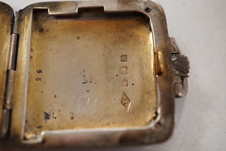 A George V silver and blue guilloche enamel travelling folding timepiece, maker SSM, Birmingham, 1931, with Arabic dial and subsidiary seconds, case diameter 37mm, enamel a.f.